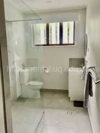 Newly renovated Bathroom 1 with large washing machine and high ceilings