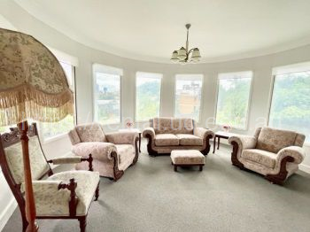 Lounge room with extremely comfortable newly restored antique couches, city views, double glazed windows, 55in TV